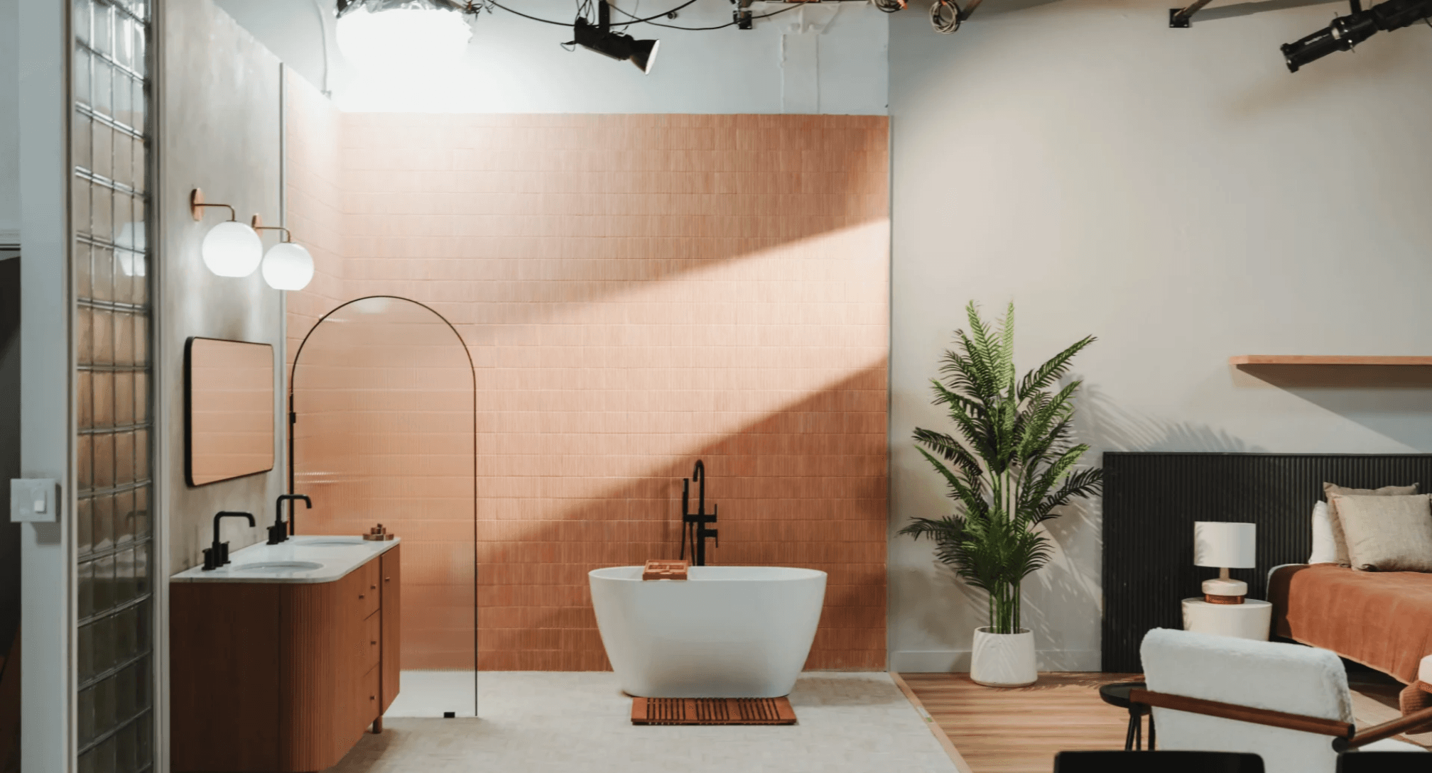 Bathroom set with dramatic overhead lighting and soaking tub for beauty and wellness campaigns — GMA Creative House