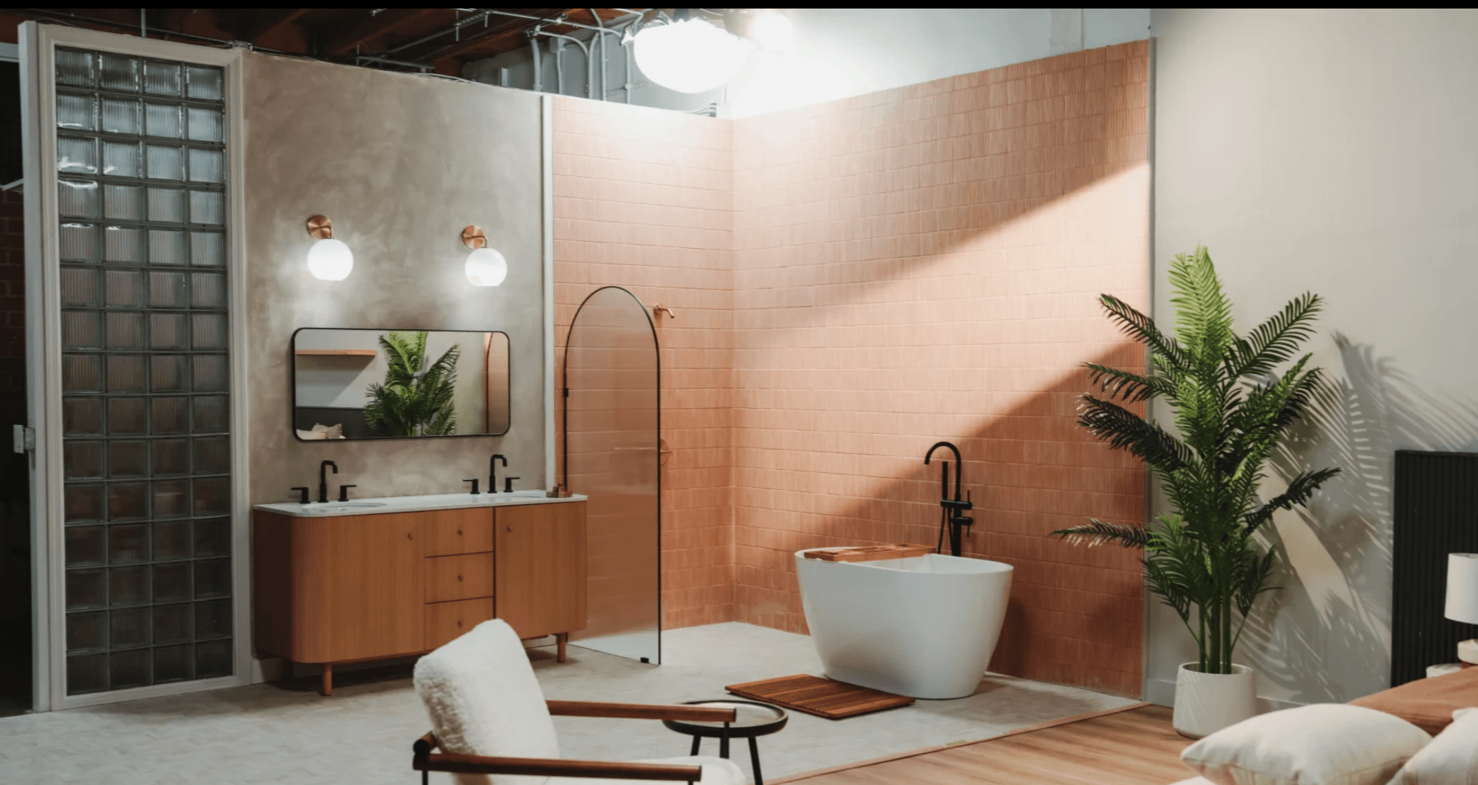 Spa bathroom set with pink tile accent wall and freestanding soaking tub for beauty and wellness content — GMA Creative House