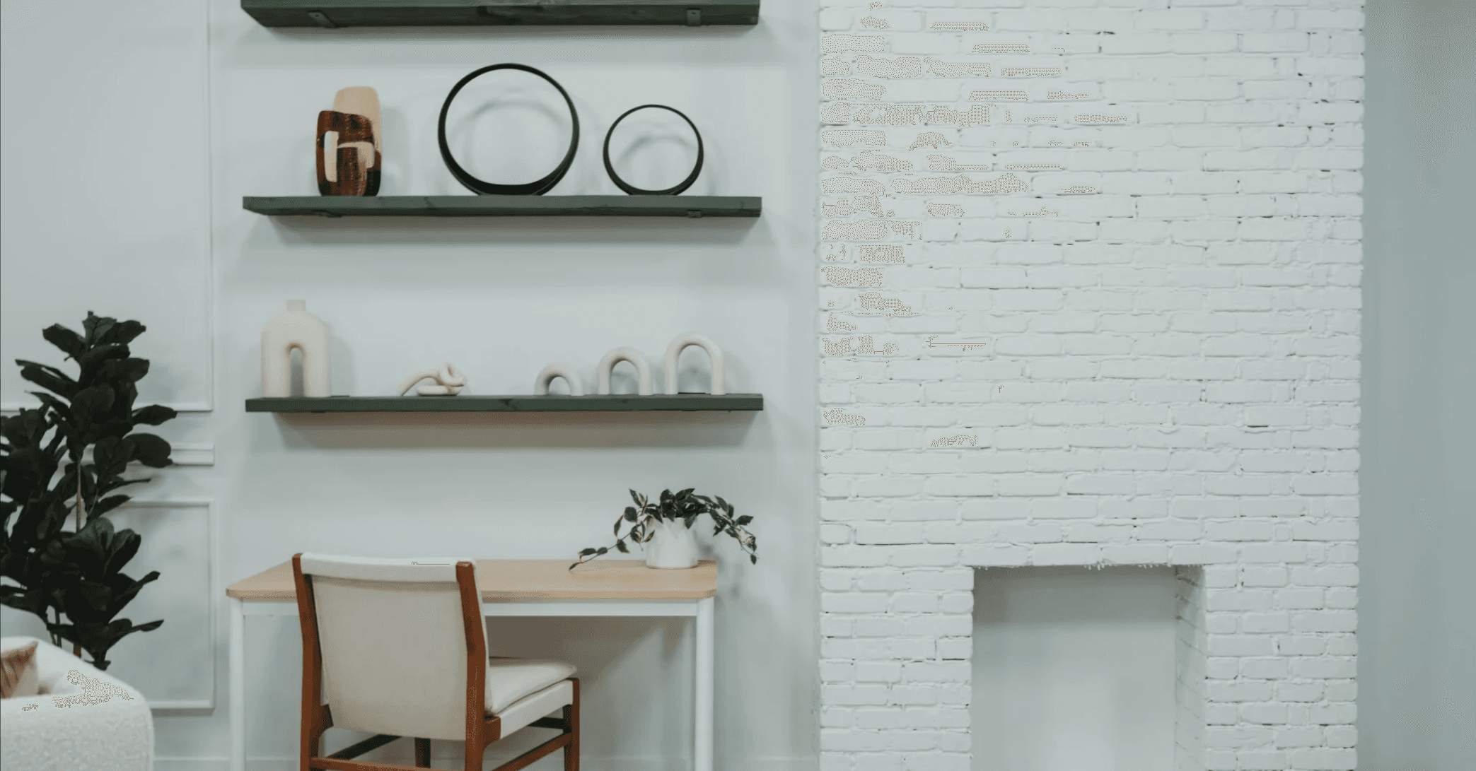 Whitewashed brick fireplace nook with floating shelves for editorial photography — Los Angeles production studio rental
