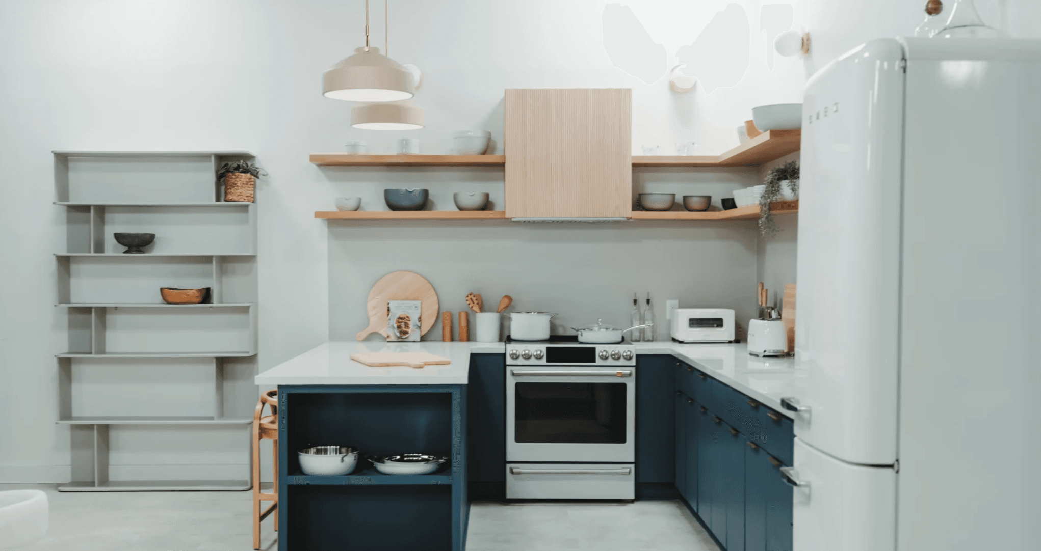 Editorial kitchen set with navy cabinets and brass hardware for food and product photography — GMA Creative House LA